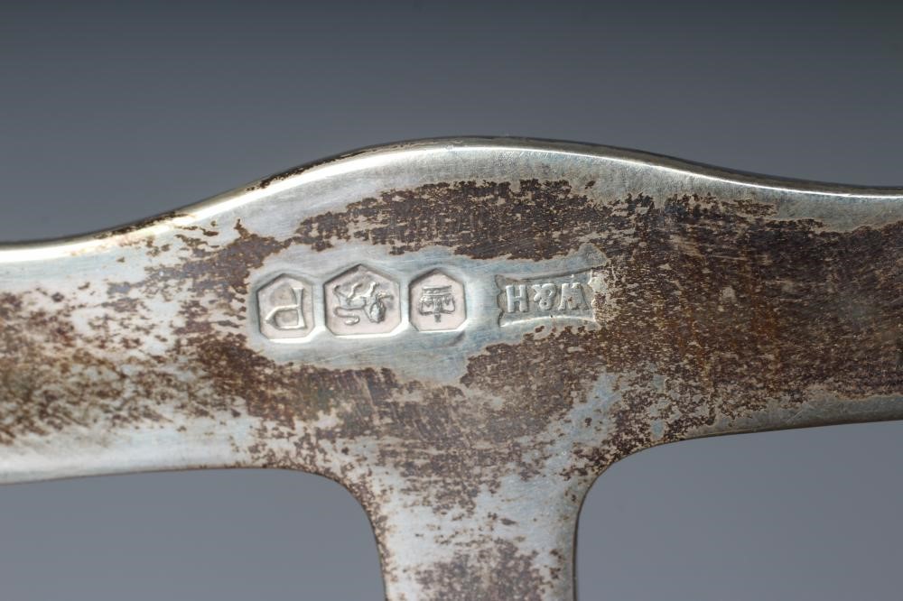 AN ELIZABETH II SILVER SEVEN BAR TOASTRACK by Walker & Hall Image