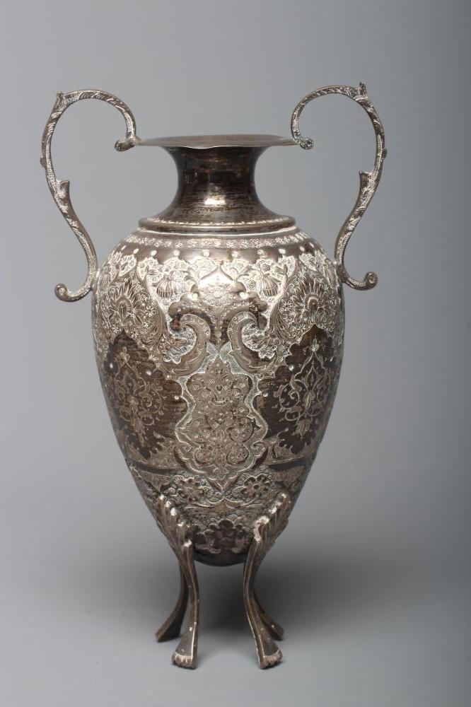 AN IRANIAN TWO HANDLED VASE of rounded conical form Image