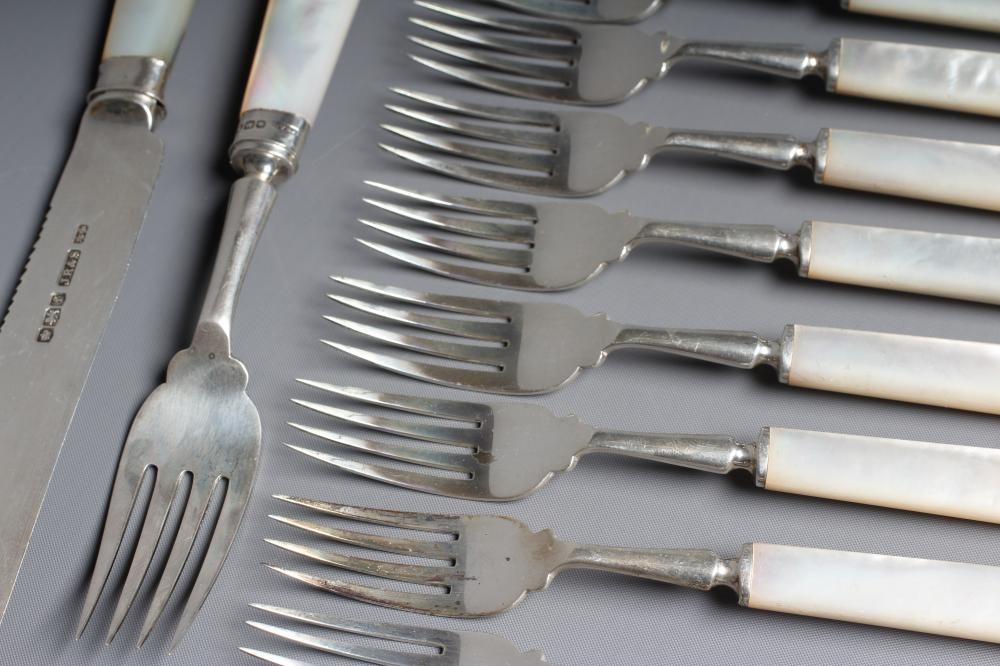 A GEORGE V SILVER SET OF TWELVE PAIRS OF FRUIT KNIVES AND FORKS Joseph Rodgers & Sons Image