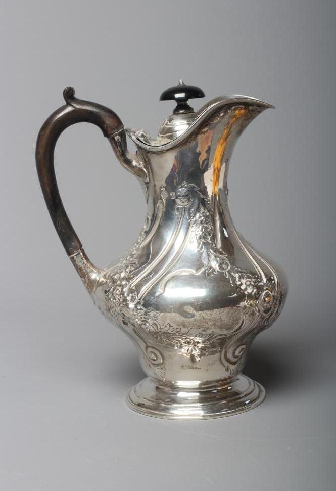 A LATE VICTORIAN SILVER HOT WATER JUG by Martin Image