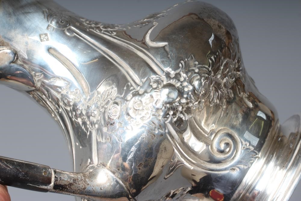 A LATE VICTORIAN SILVER HOT WATER JUG by Martin Image