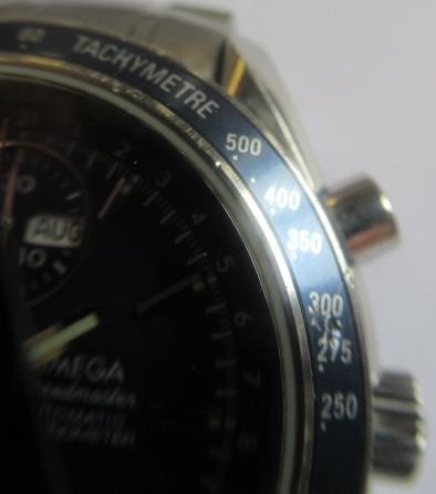 A GENTLEMAN'S OMEGA SPEEDMASTER TRIPLE CALENDAR AUTOMATIC CHRONOGRAPH Image