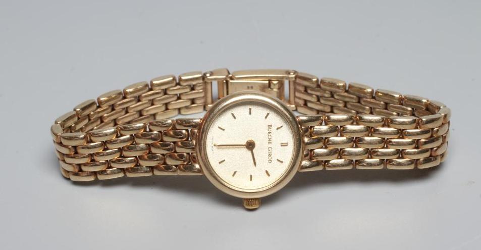 A LADY'S 9CT GOLD BUECHE GIROD WRISTWATCH Image