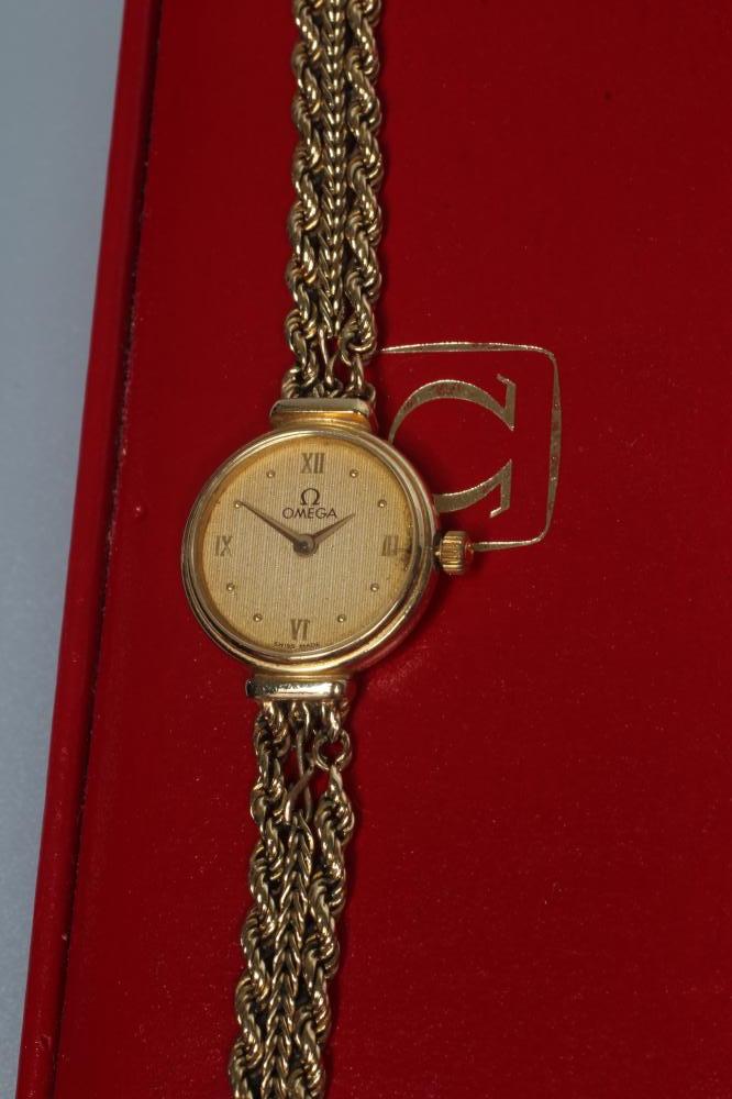 A LADY'S 9CT GOLD OMEGA WRISTWATCH Image
