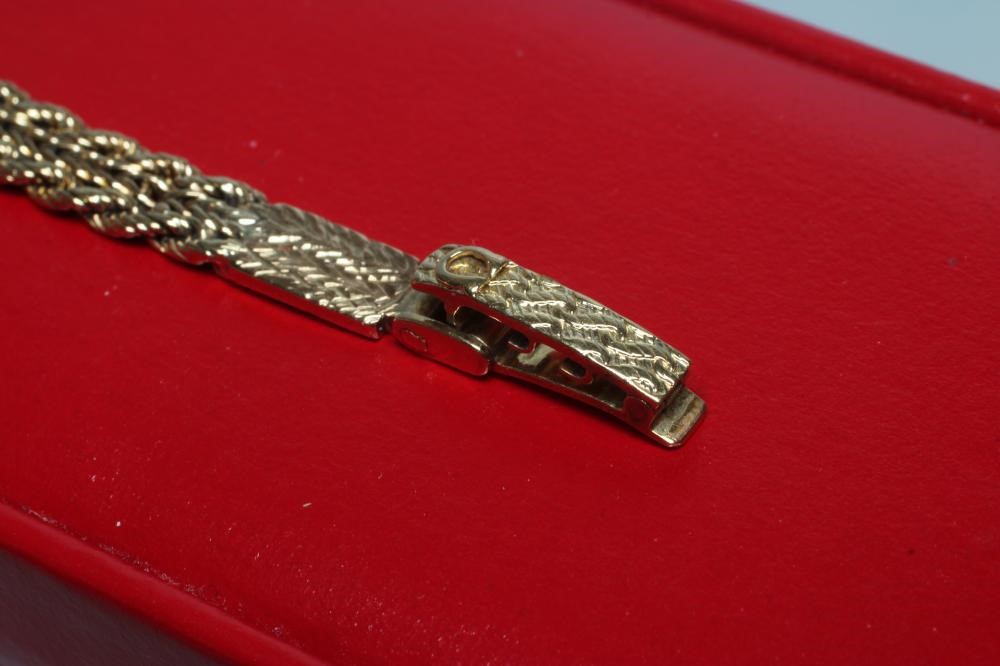 A LADY'S 9CT GOLD OMEGA WRISTWATCH Image