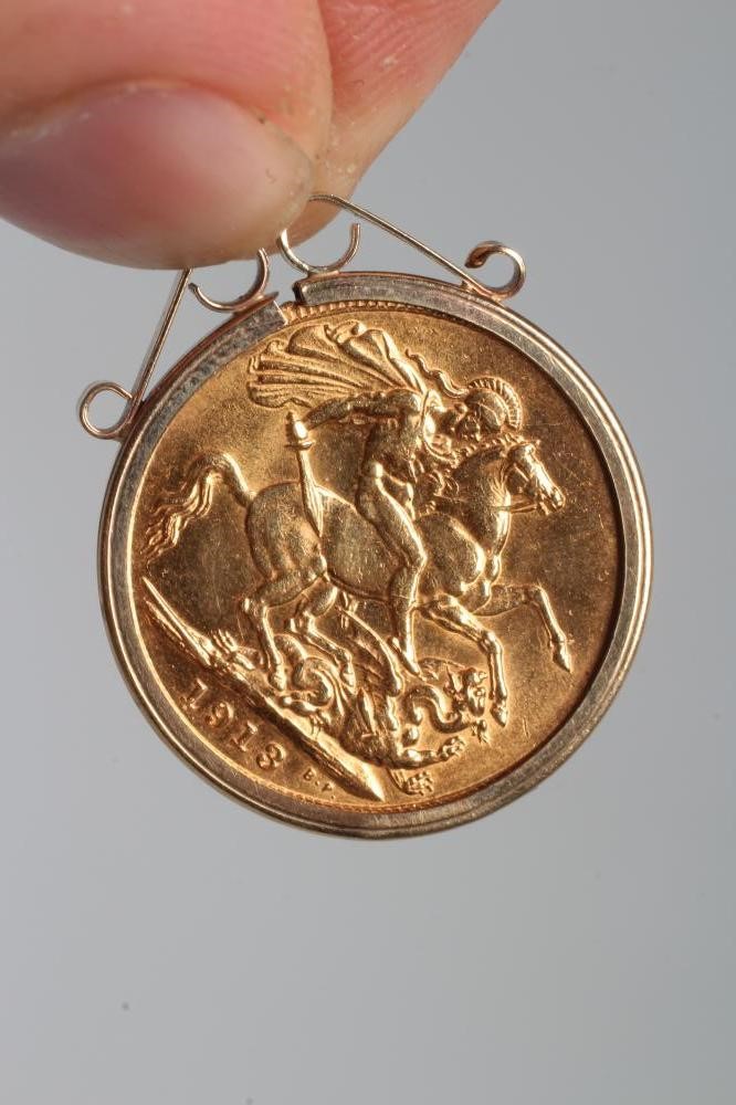 A GEORGE V SOVEREIGN, 1913, in a 9ct gold pendant loose mount, hung from a 9ct gold fancy watch Image