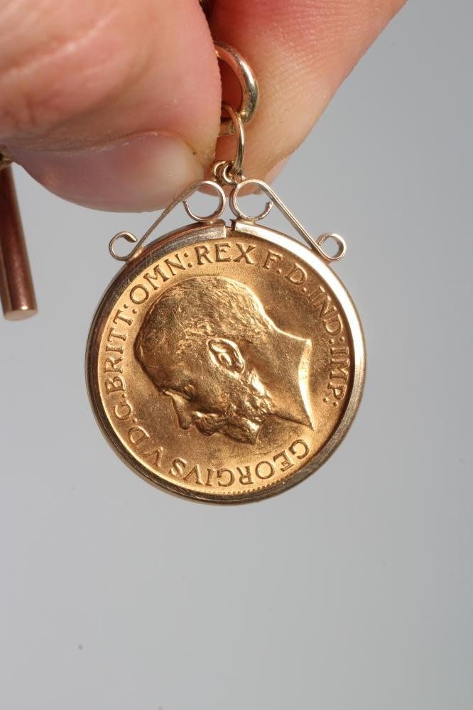 A GEORGE V SOVEREIGN, 1913, in a 9ct gold pendant loose mount, hung from a 9ct gold fancy watch Image
