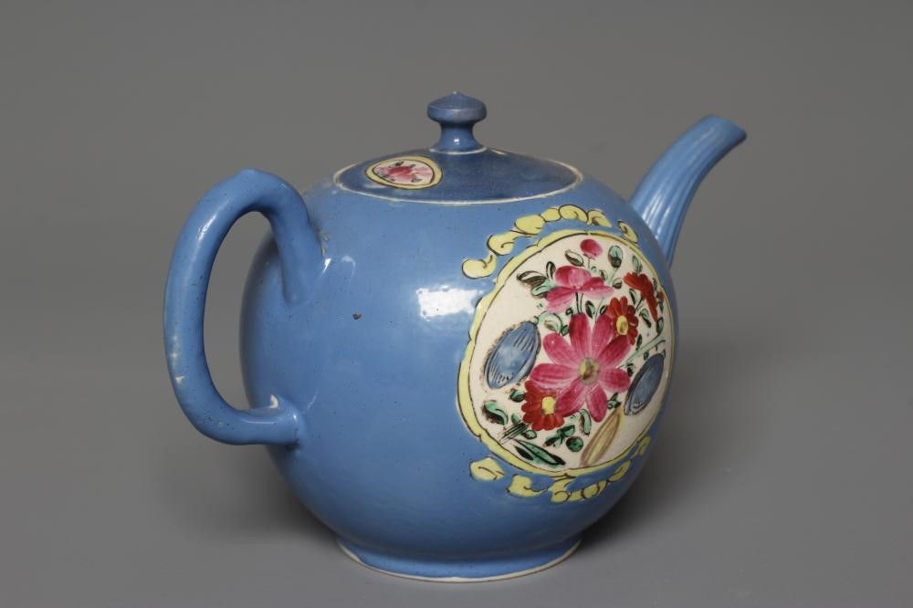 A STAFFORDSHIRE POLYCHROME SALTGLAZE STONEWARE TEAPOT AND COVER of globular form with crabstock Image