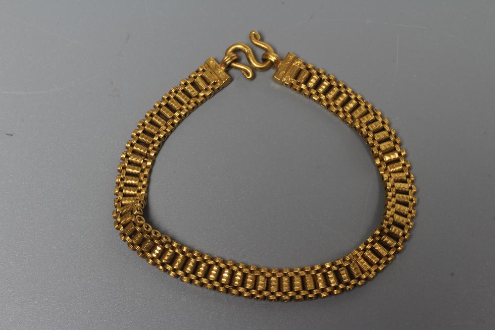 A THAI BRACELET stamped 96.5% TT, crown over KHL, with coiled wirework links and S loop fastener, Image