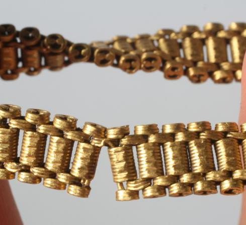 A THAI BRACELET stamped 96.5% TT, crown over KHL, with coiled wirework links and S loop fastener, Image