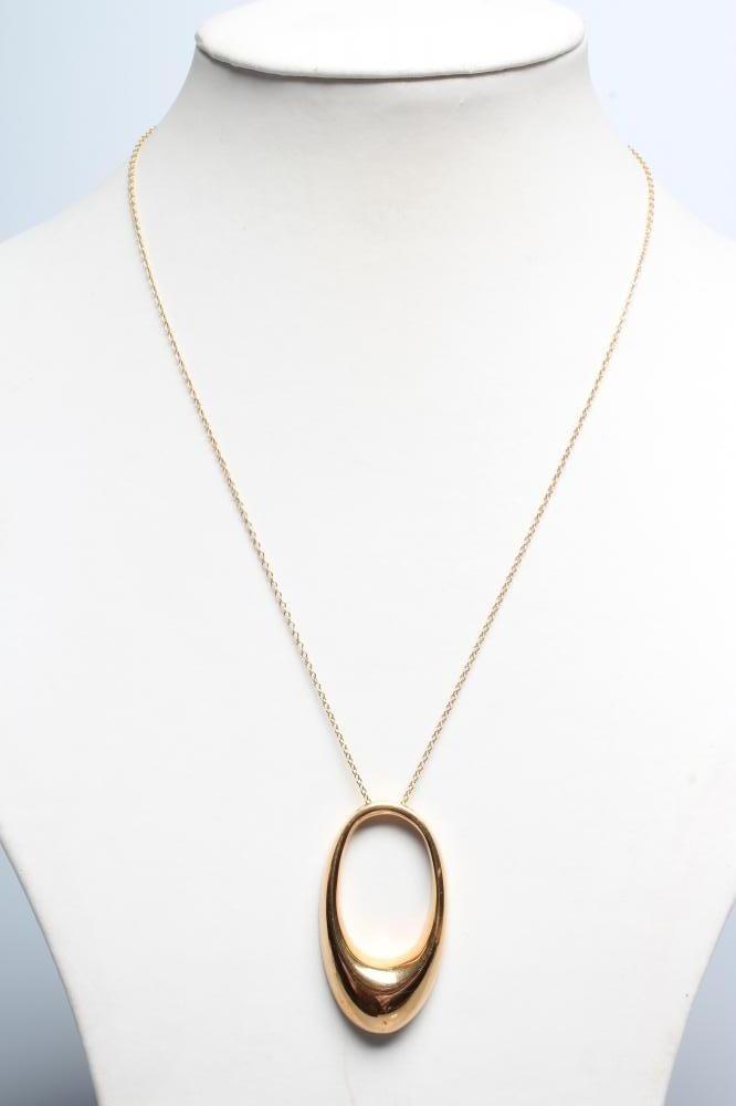 AN ITALIAN PENDANT stamped 750 * MIL, of abstract open oval form, on integral threaded chain stamped Image