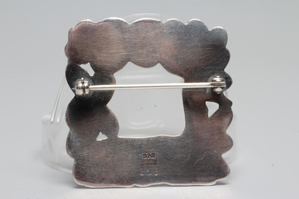 A GEORG JENSEN SILVER SQUARE BROOCH designed by Arno Malinowski with a recumbant deer and squirrel, Image