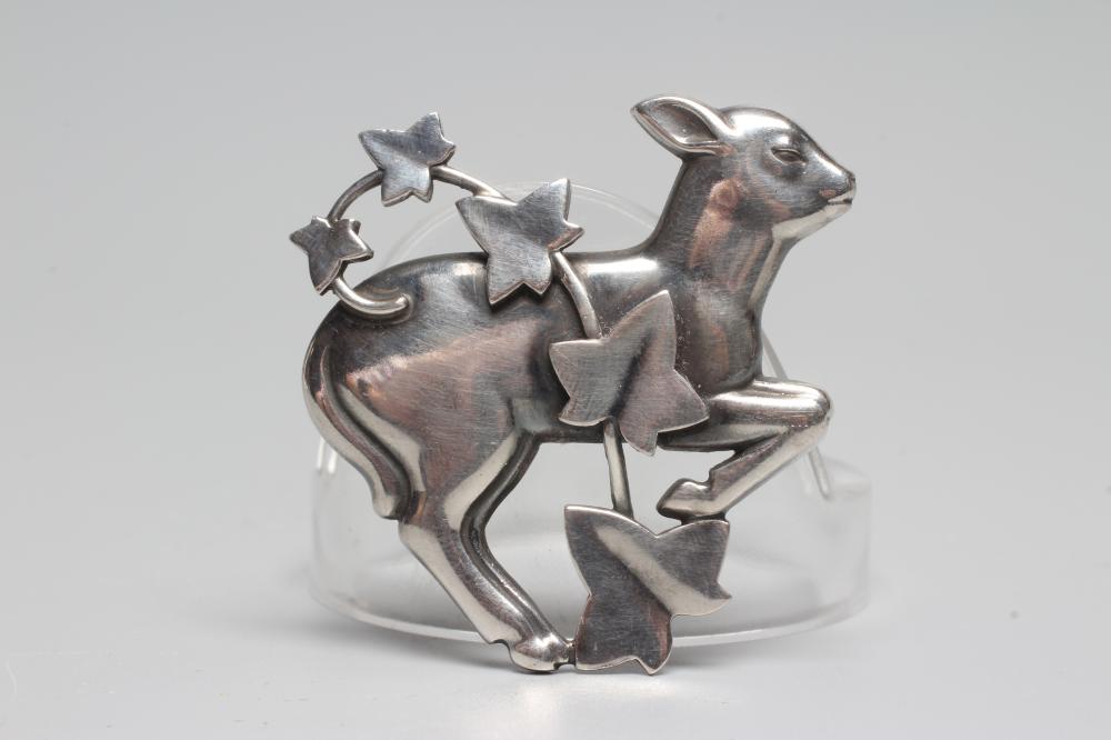 A GEORG JENSEN SILVER BROOCH designed by Arno Malinowski as a lamb with a branch of ivy, stamped Image