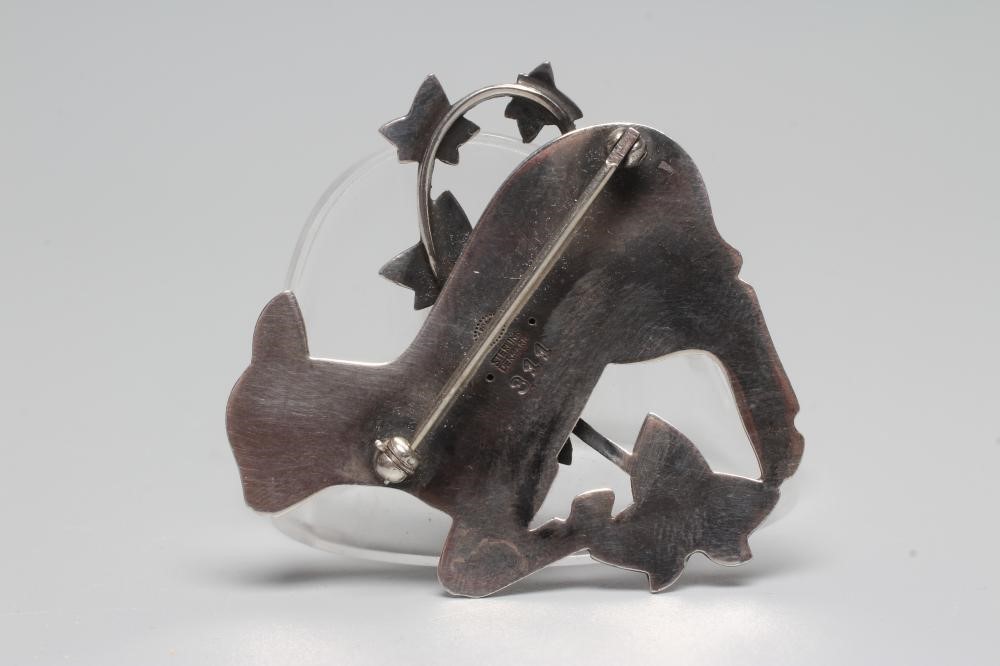 A GEORG JENSEN SILVER BROOCH designed by Arno Malinowski as a lamb with a branch of ivy, stamped Image