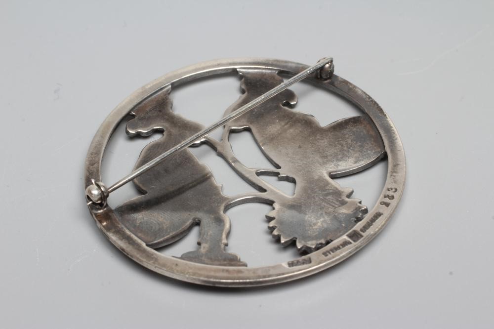 A GEORG JENSEN SILVER CIRCULAR MOONLIGHT BLOSSOM BROOCH designed by Arno Malinowski with two Image