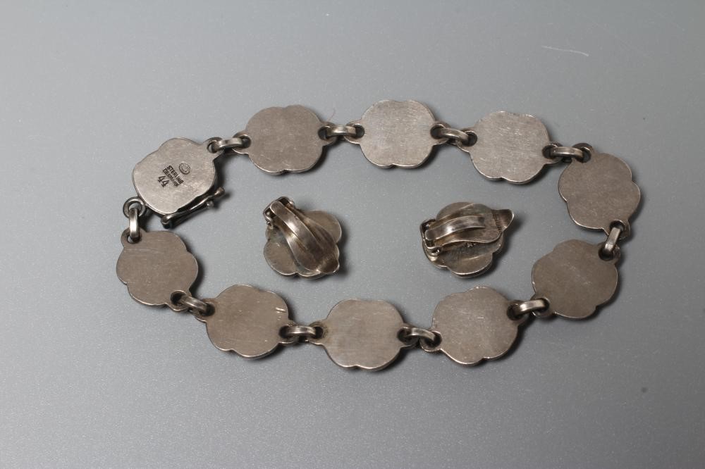 A GEORG JENSEN SILVER ROSE BRACELET designed by Georg Jensen, stamped Sterling 44, together with a Image