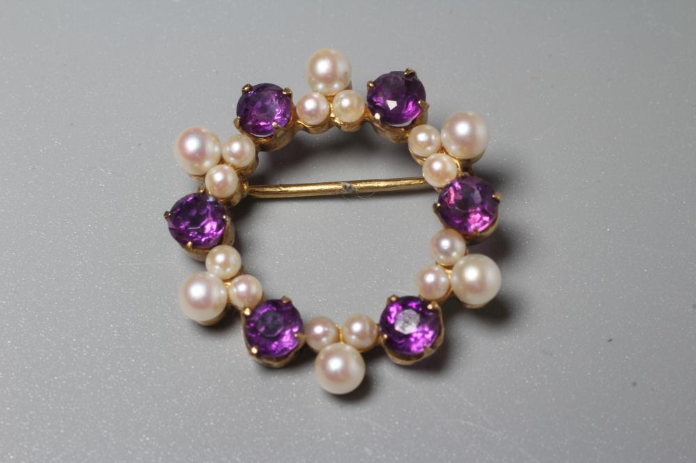 AN AMETHYST AND CULTURED PEARL WREATH BROOCH claw set with six facet cut amethysts and six triple Image