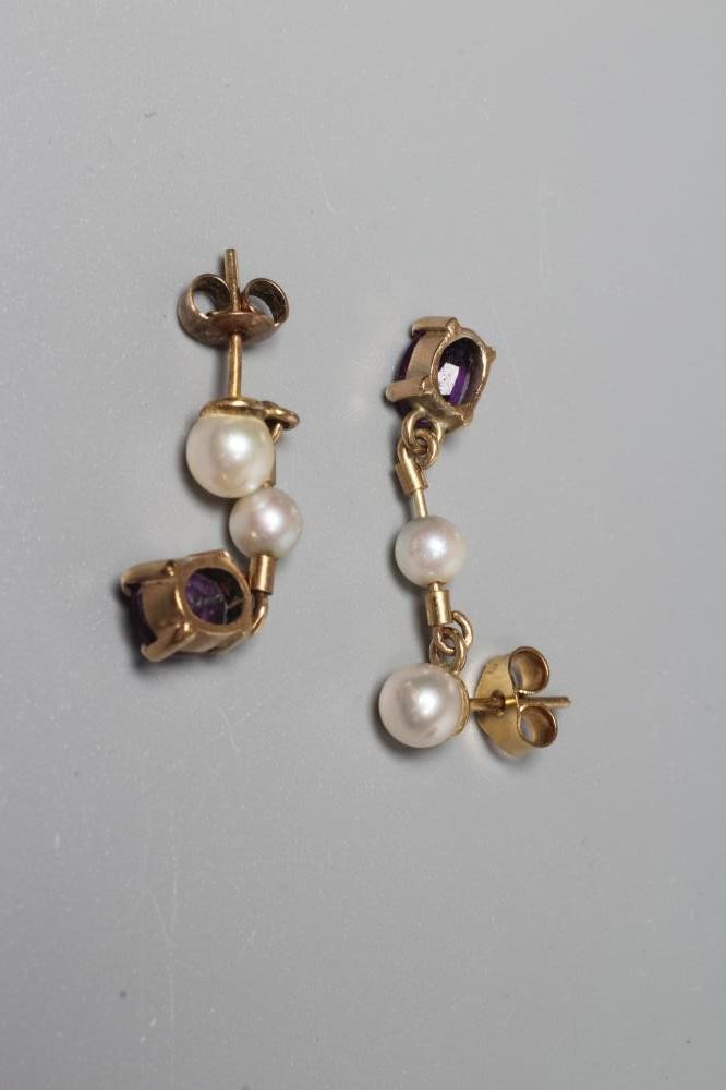 A PAIR OF AMETHYST AND CULTURED PEARL DROP EAR STUDS Image