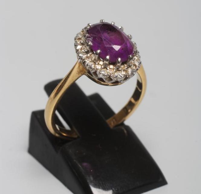 AN AMETHYST AND DIAMOND CLUSTER RING Image