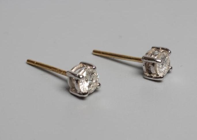 A PAIR OF DIAMOND SOLITAIRE EAR STUDS Image