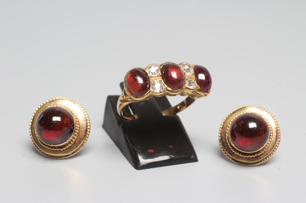 A GARNET AND DIAMOND RING Image