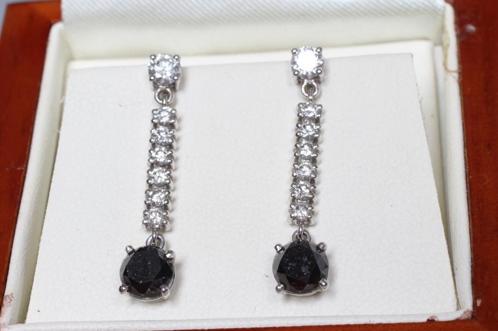 A PAIR OF DIAMOND DROP EARRINGS Image