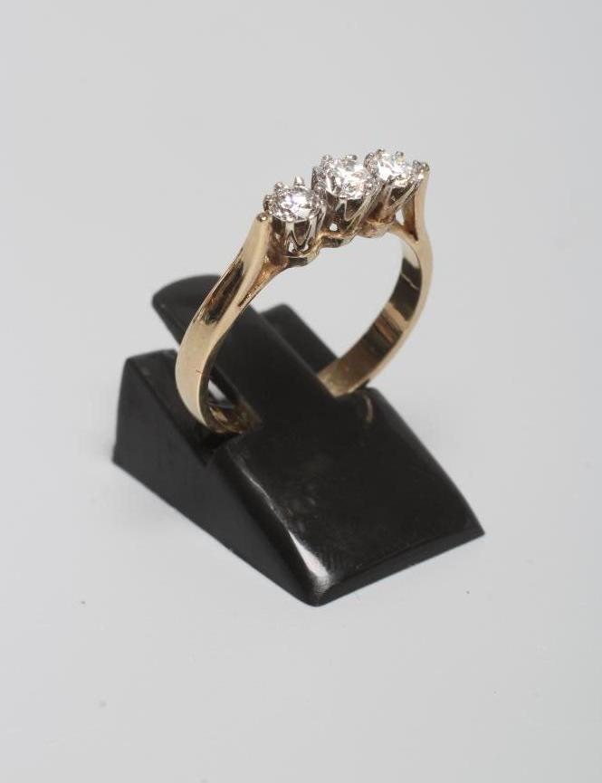 A THREE STONE DIAMOND RING Image