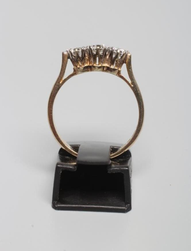 A THREE STONE DIAMOND RING Image