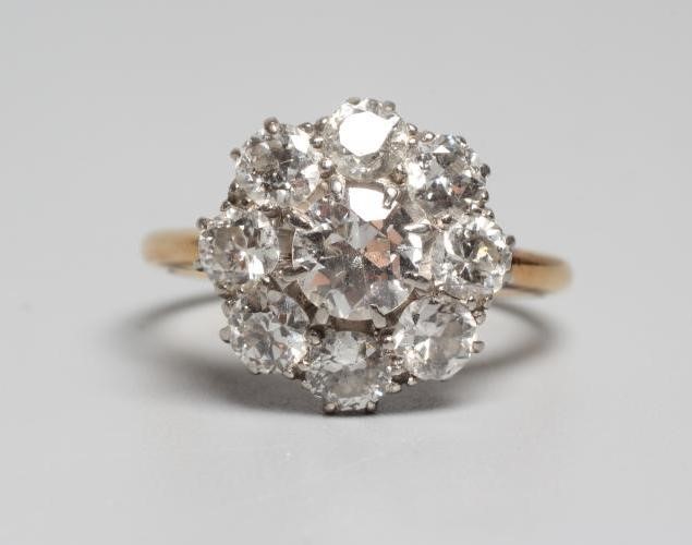 A NINE STONE DIAMOND CLUSTER RING Image