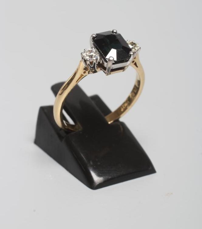 A SAPPHIRE AND DIAMOND THREE STONE RING Image