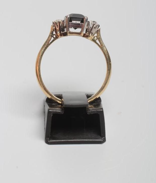 A SAPPHIRE AND DIAMOND THREE STONE RING Image