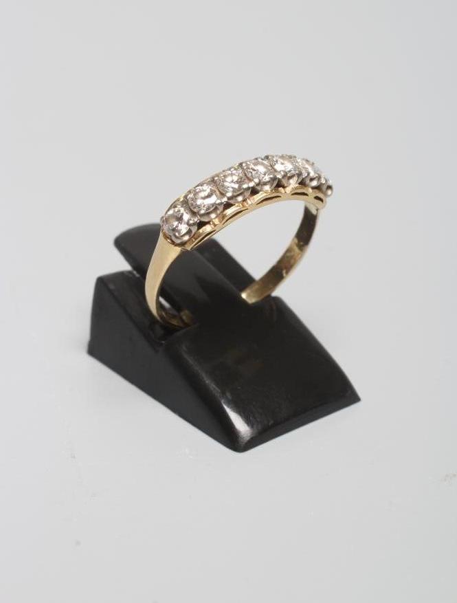 A SEVEN STONE DIAMOND RING Image