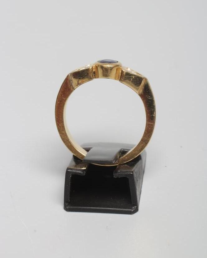 A SAPPHIRE AND DIAMOND THREE STONE RING Image