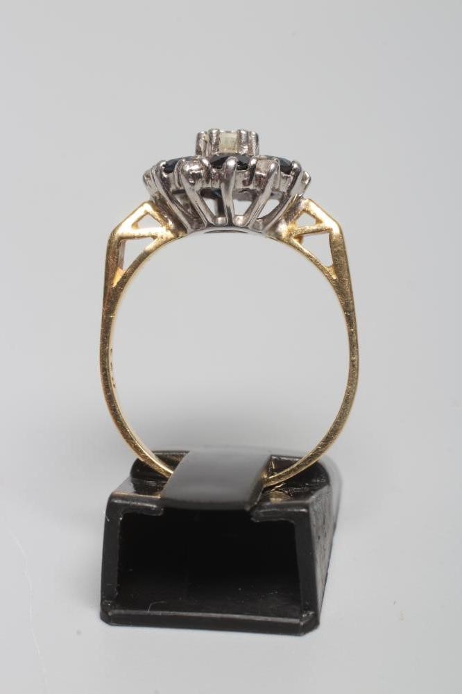 A SAPPHIRE AND DIAMOND CLUSTER RING Image