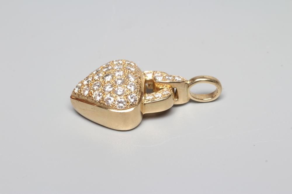 A DIAMOND PADLOCK PENDANT, the heart shaped panel pave set with numerous brilliant cut stones to a Image