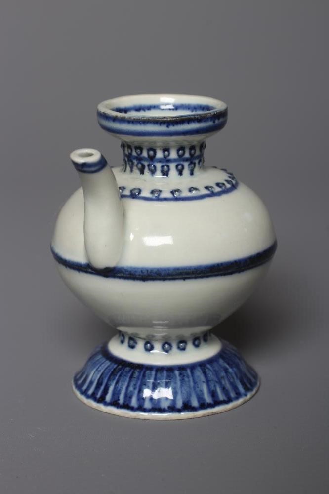 A CHINESE PORCELAIN WATER DROPPER of rounded double conical form, the shoulders moulded with dots Image