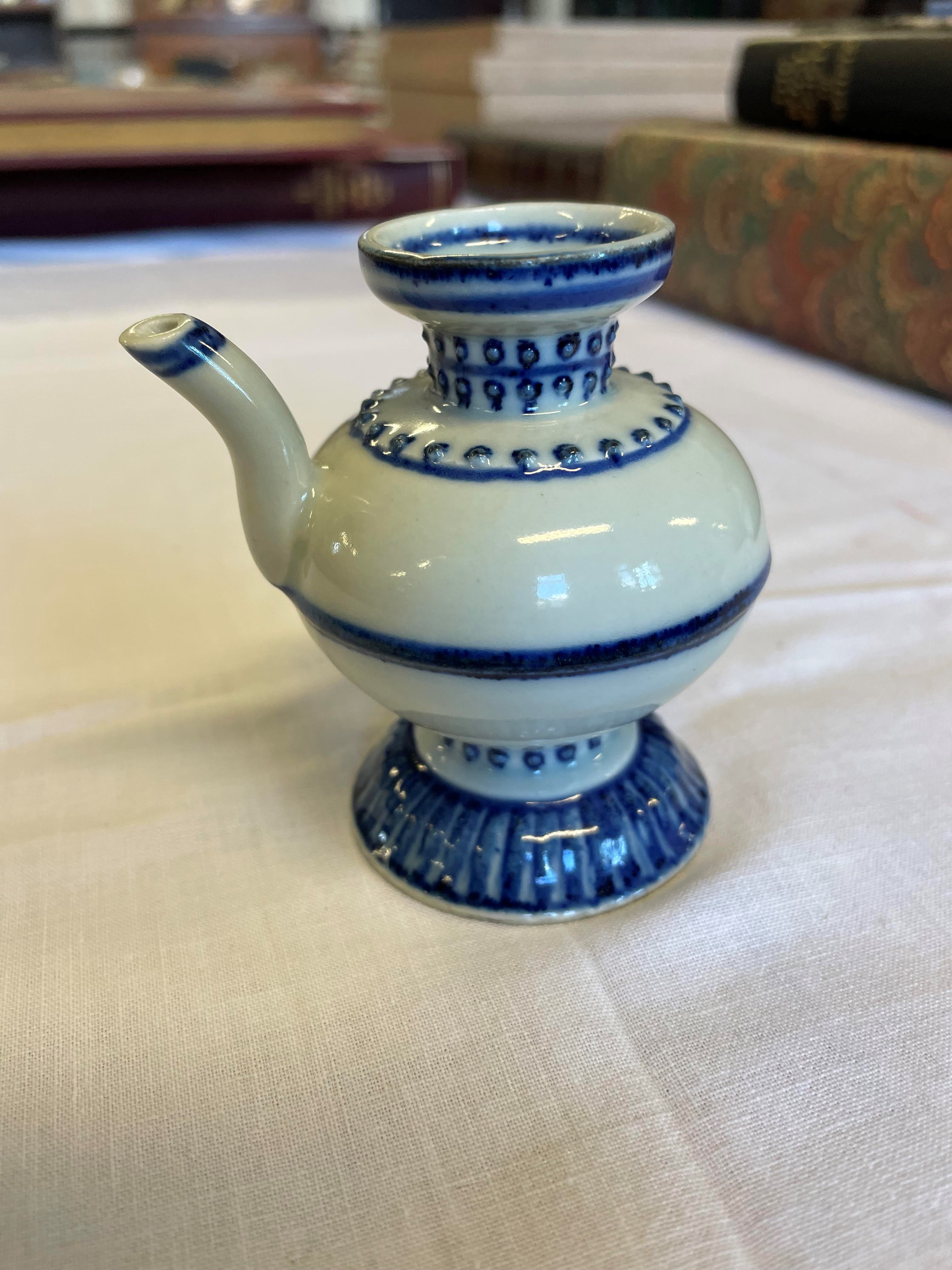 A CHINESE PORCELAIN WATER DROPPER of rounded double conical form, the shoulders moulded with dots Image