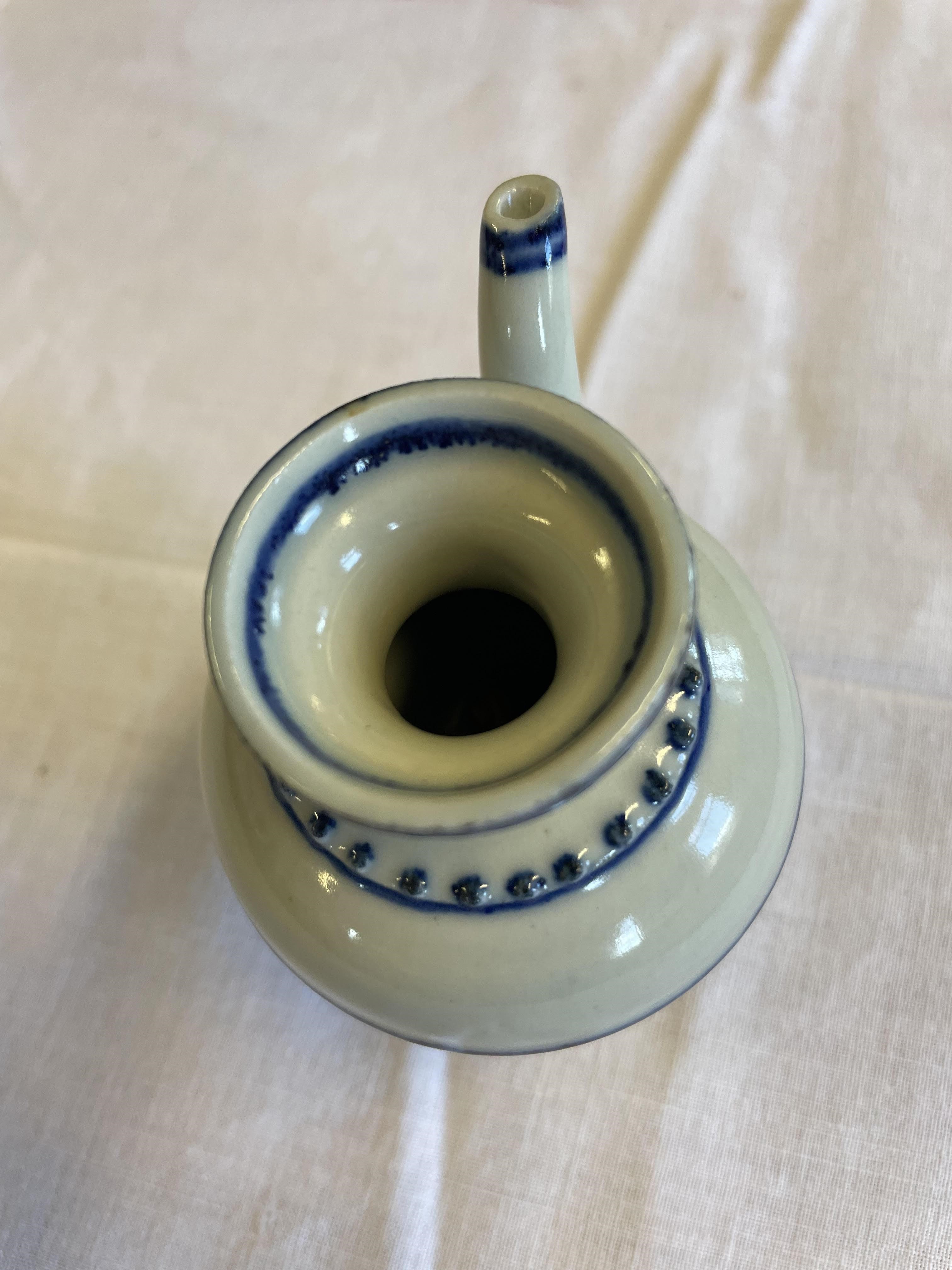 A CHINESE PORCELAIN WATER DROPPER of rounded double conical form, the shoulders moulded with dots Image