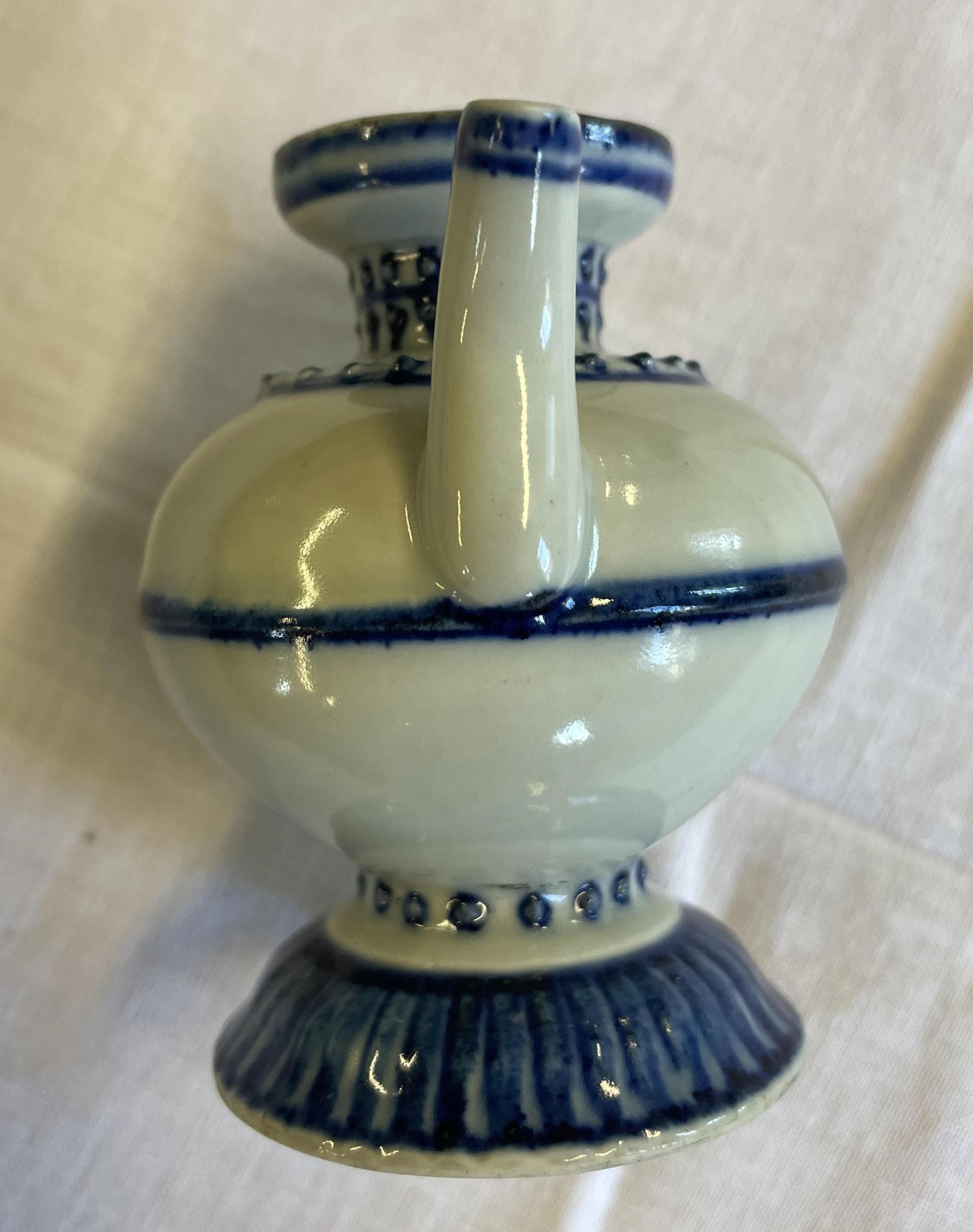 A CHINESE PORCELAIN WATER DROPPER of rounded double conical form, the shoulders moulded with dots Image
