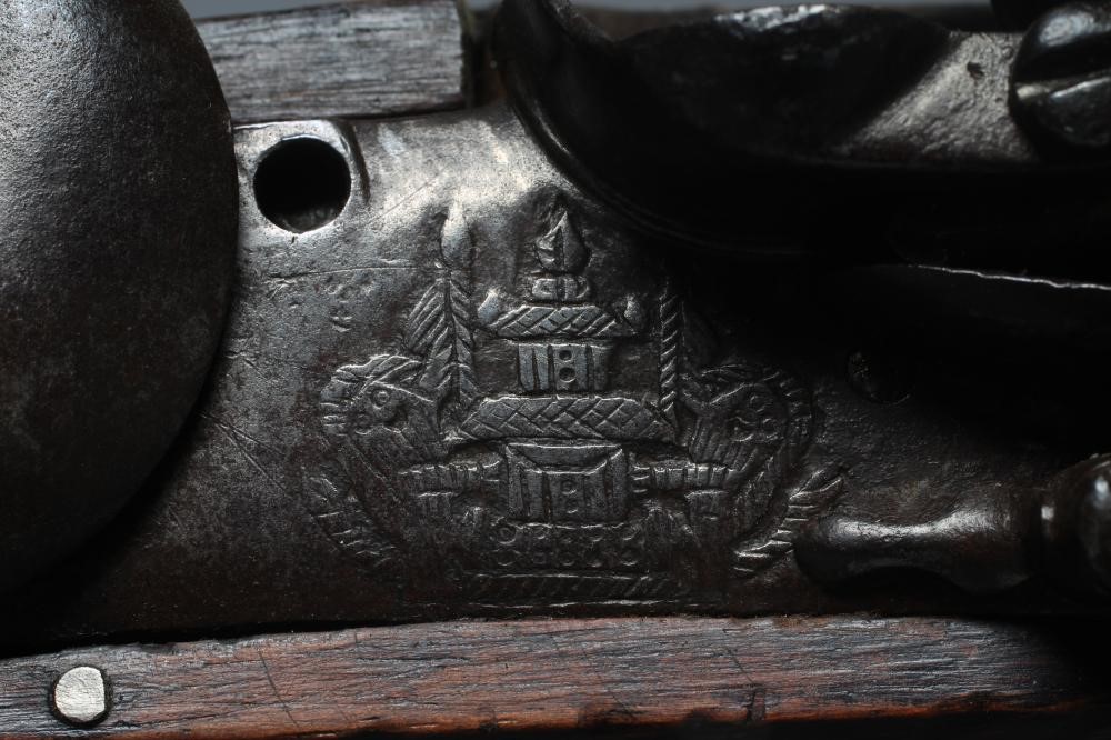 A FLINTLOCK MILITARY MUSKET with 39 3/8" barrel, action etched with pagoda style armorial, walnut Image