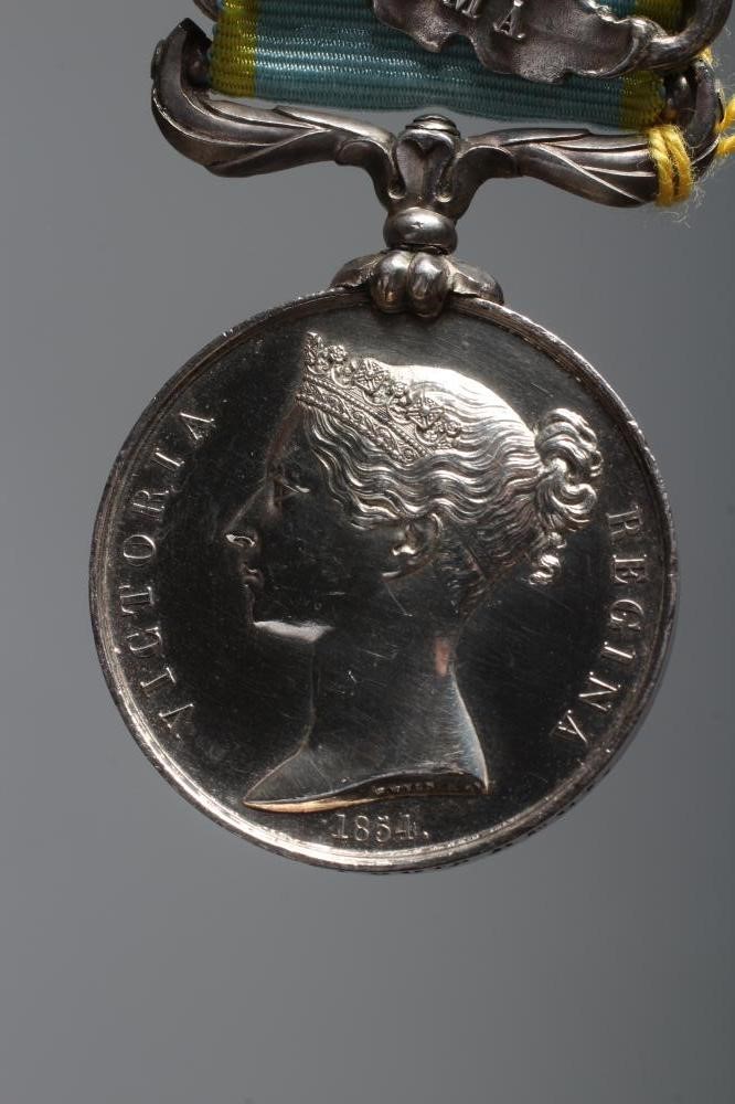 A CRIMEA 1854 MEDAL, awarded to J. Aust of the 30th Regiment, with Sebastopol and Alma clasps (Est. Image