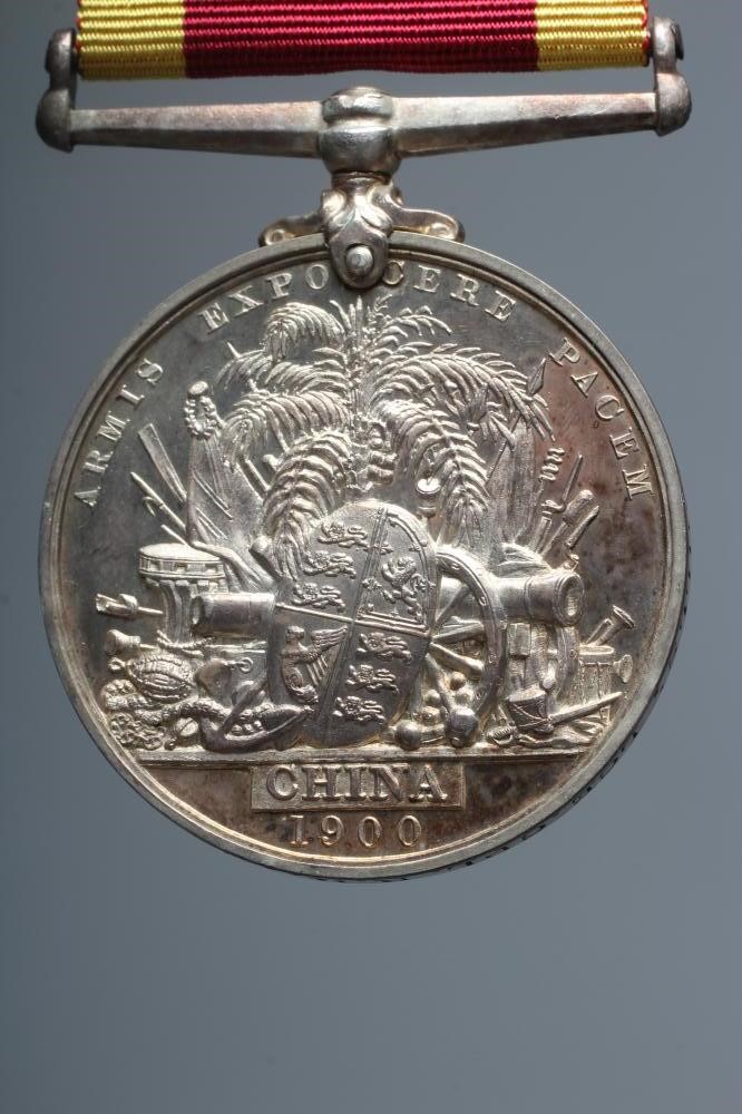 A CHINA 1900 MEDAL, awarded to Lance Corporal E. E. Mills of the Royal Marines, HMS Marathon (Est. Image