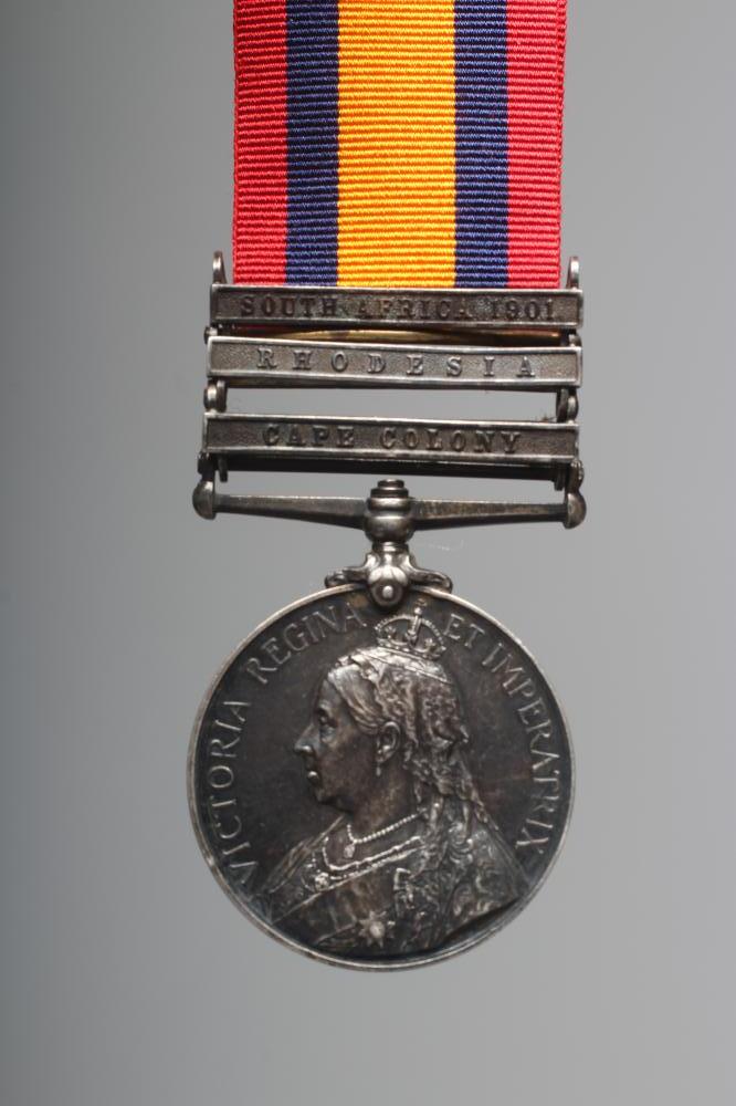 A SOUTH AFRICA MEDAL, with clasps for South Africa 1901, Rhodesia and Cape Colony, awarded to Cpl. Image