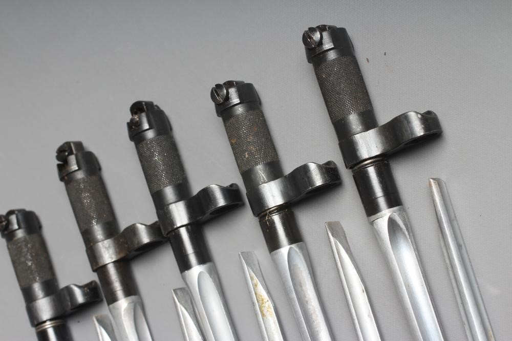 TEN CHINESE TYPE 56 SKS BAYONETS each with 7 3/4" blades and machined sprung grips, both 11" overall Image