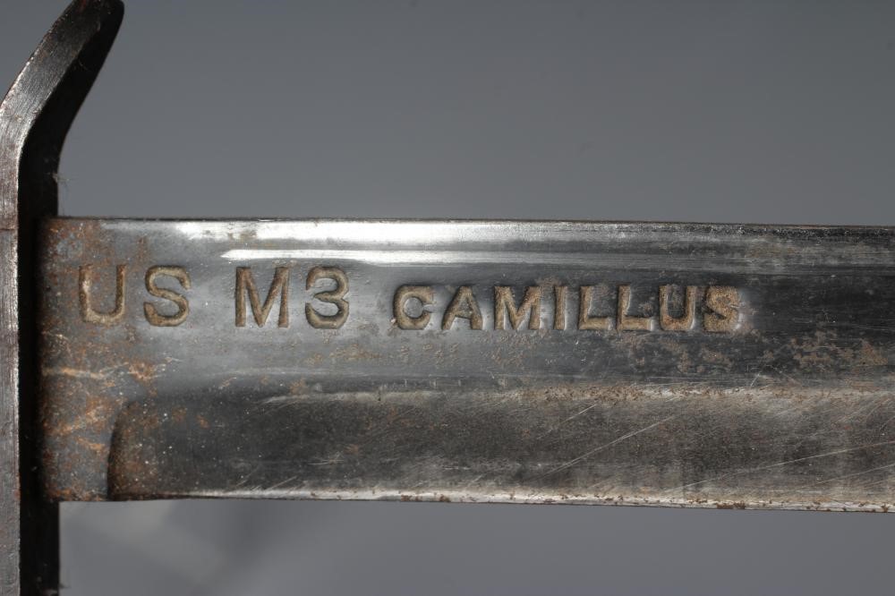 A US M3 CAMILLUS FIGHTING KNIFE with 6 5/8" spear point blade, leather sectional grip, and leather Image