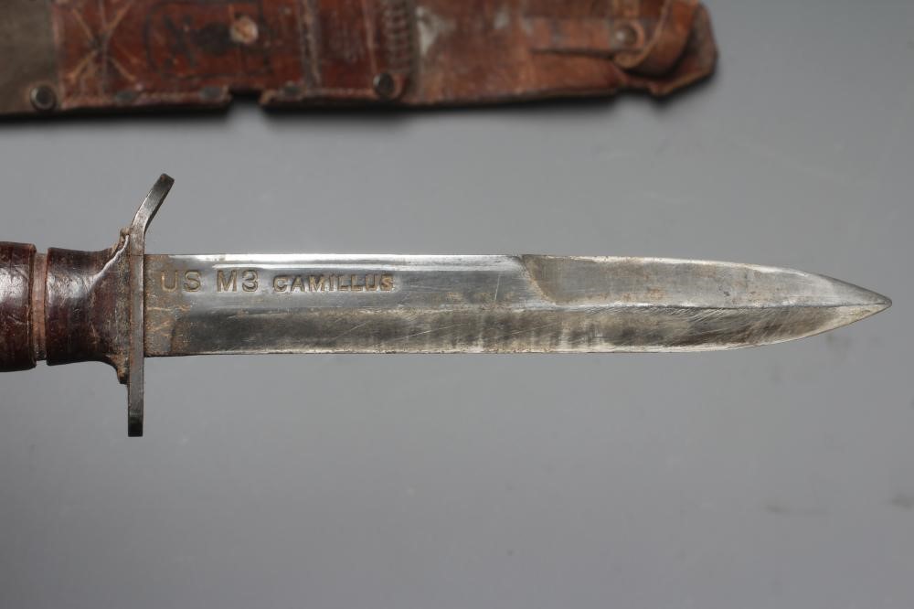 A US M3 CAMILLUS FIGHTING KNIFE with 6 5/8" spear point blade, leather sectional grip, and leather Image
