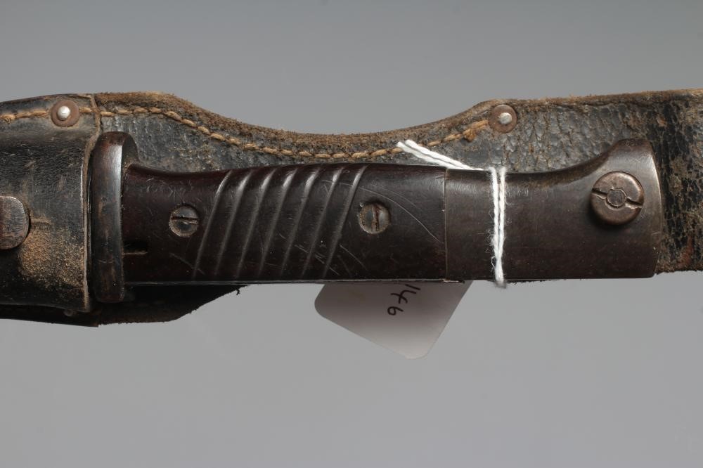 TWO BAYONETS, comprising a K98 German bayonet with steel scabbard and leather frog, and a French Image