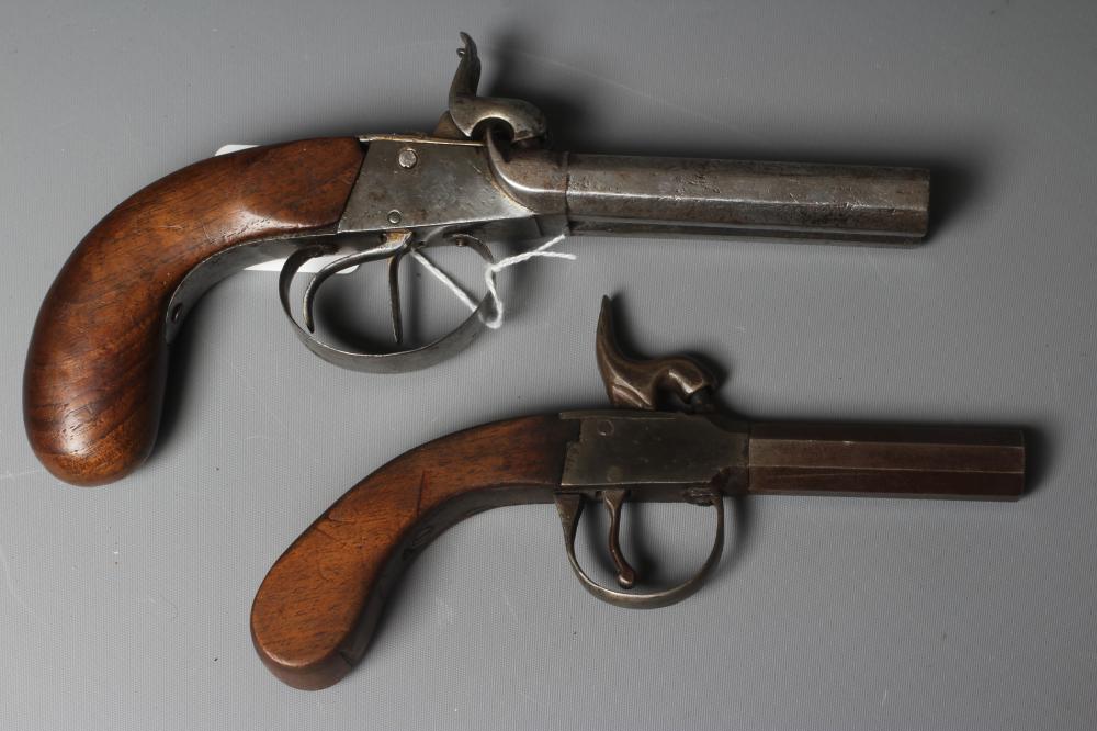 TWO PERCUSSION PISTOLS, comprising a double barrelled example with octagonal barrels, and a similar Image