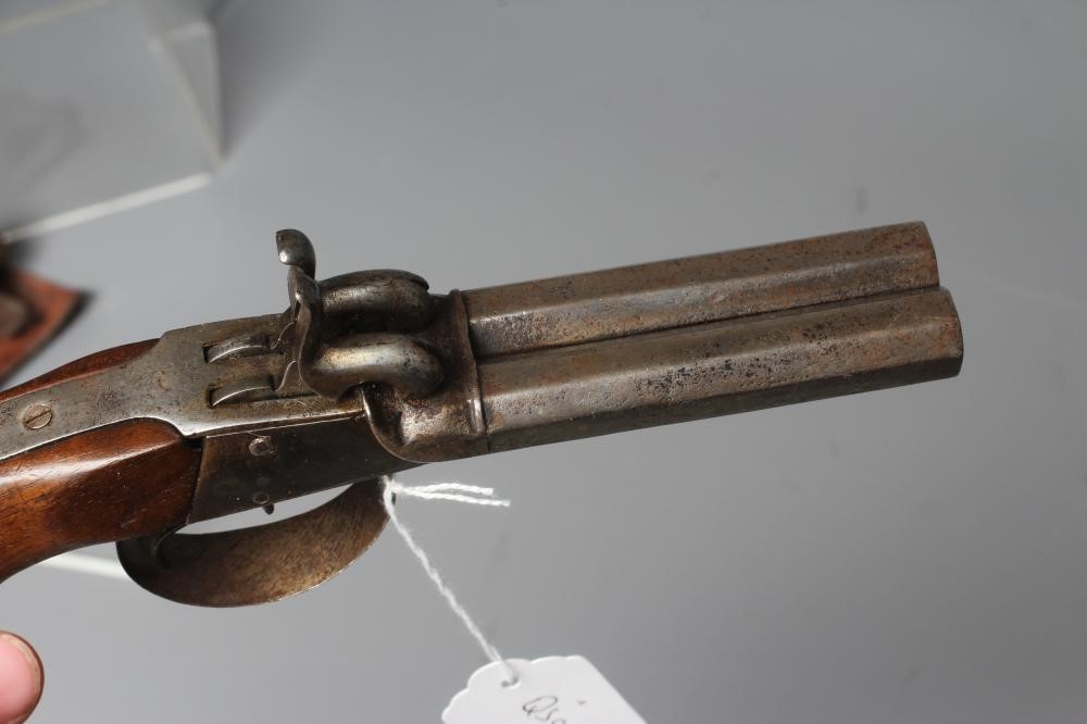 TWO PERCUSSION PISTOLS, comprising a double barrelled example with octagonal barrels, and a similar Image