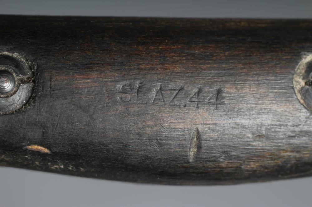 A RARE OWEN SMG BAYONET with 10" blade, two piece wood grip stamped "SLAZ44" and leather scabbard Image